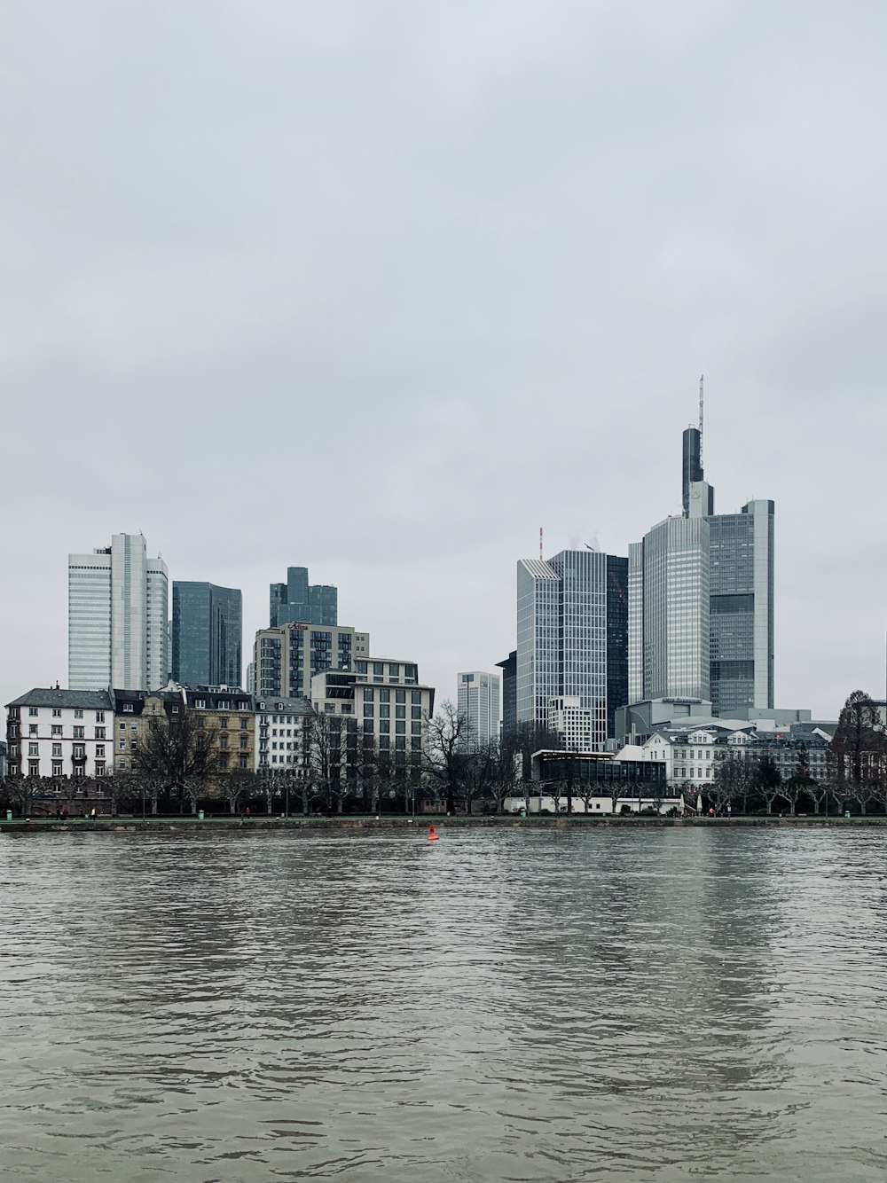 a large body of water with a city in the background