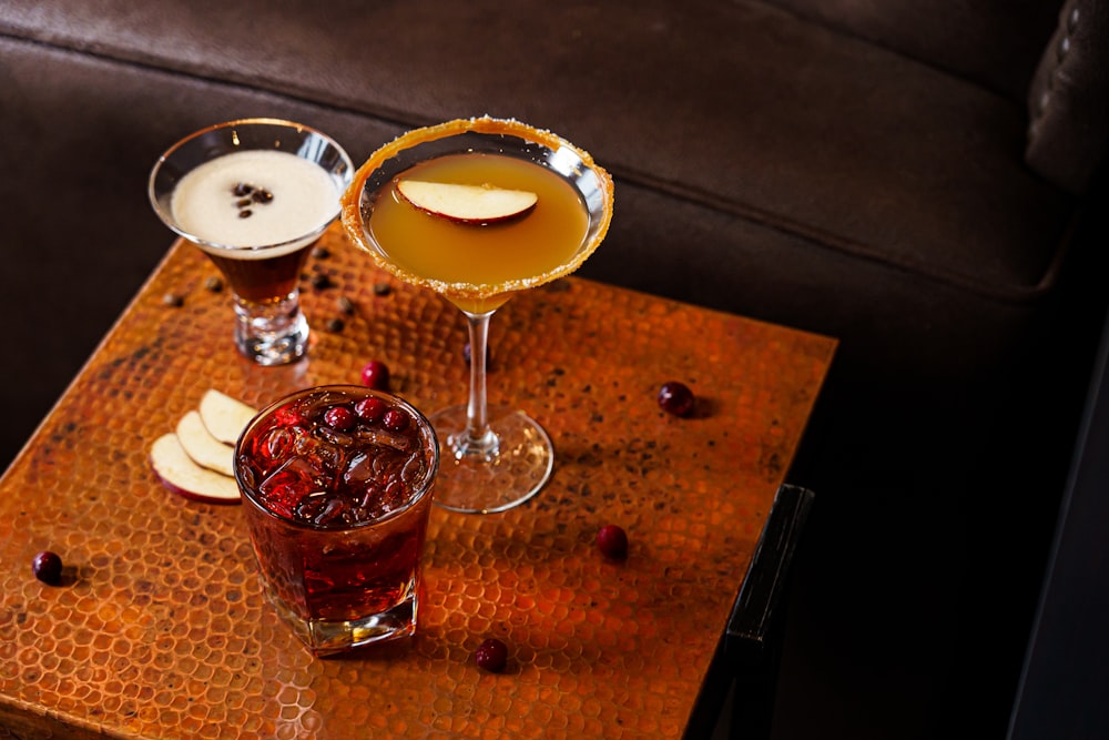 a table topped with two glasses filled with drinks