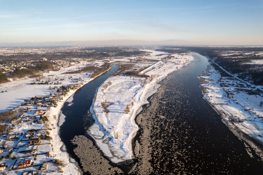 a river running through a snow covered countryside