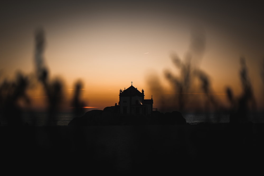 a silhouette of a building in the distance