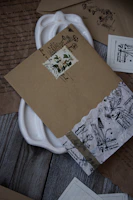 A close-up of handwritten letters and vintage documents spread out on a wooden table.