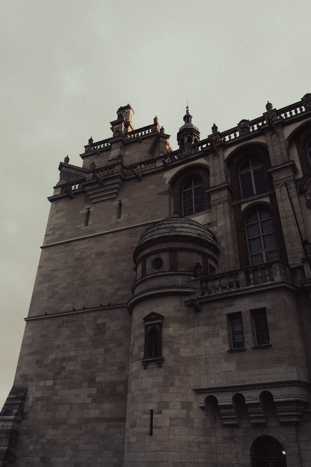 a tall building with a clock on the top of it