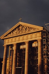 a large building with a cross on top of it