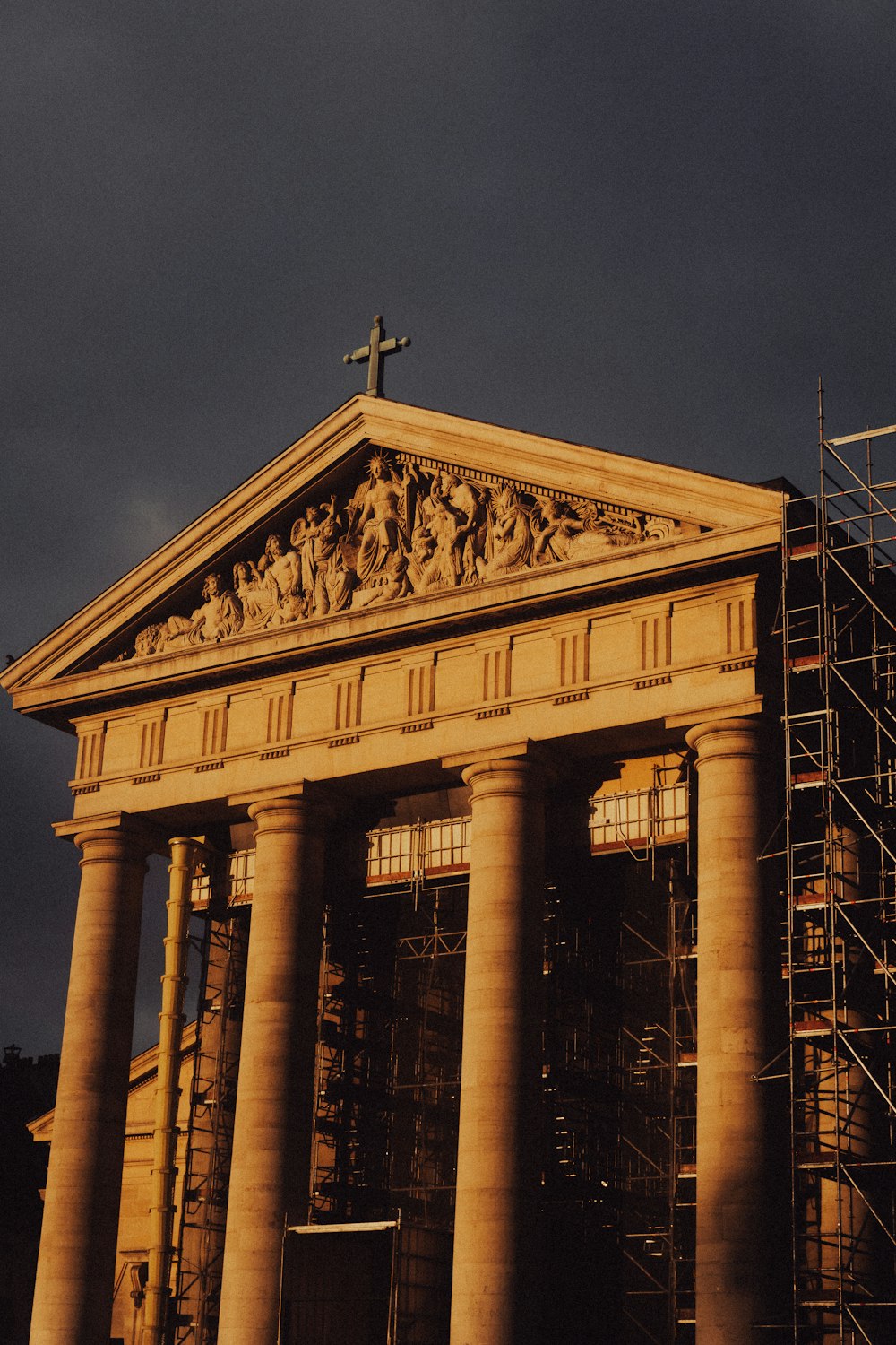 a large building with a cross on top of it