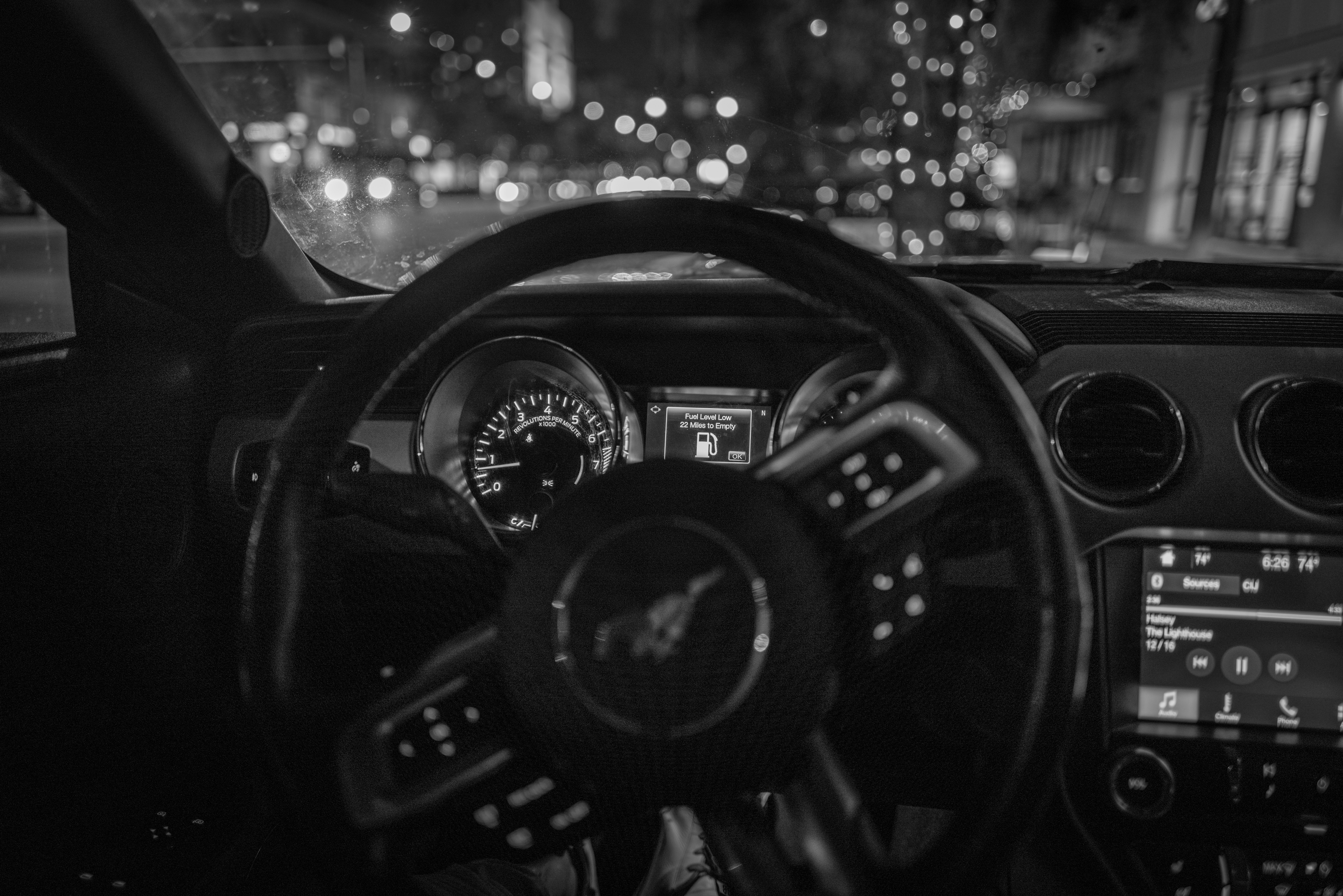 a black and white photo of a car dashboard