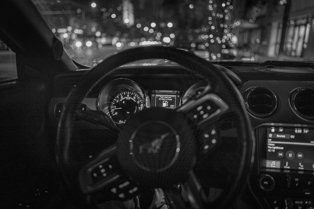 a black and white photo of a car dashboard