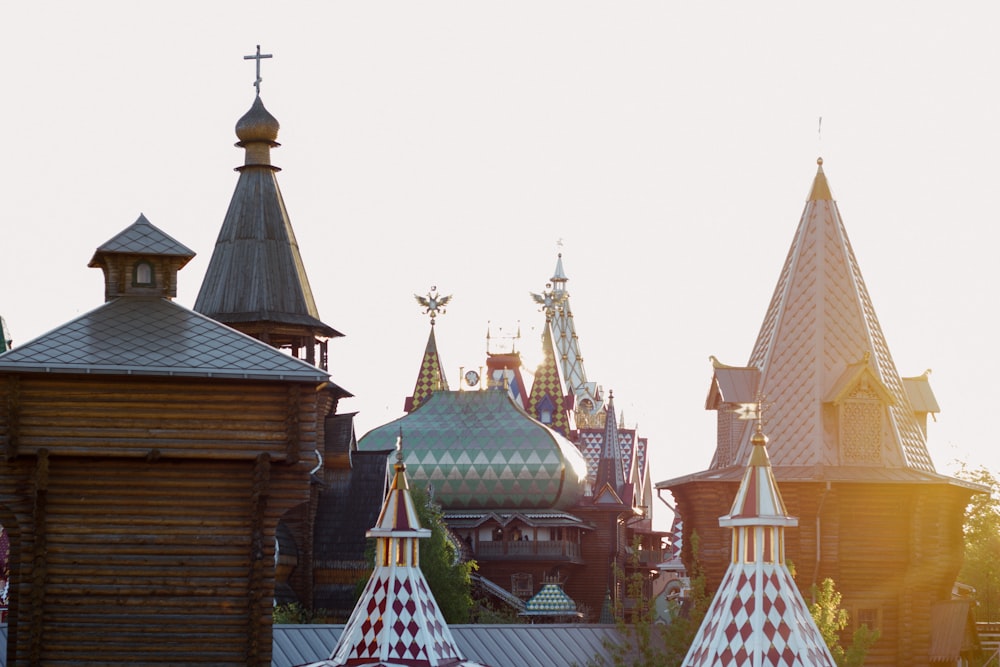 a row of buildings with a clock on each of them