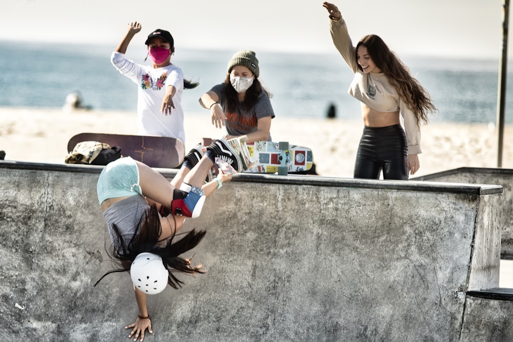 a group of young people riding skateboards on a ramp
