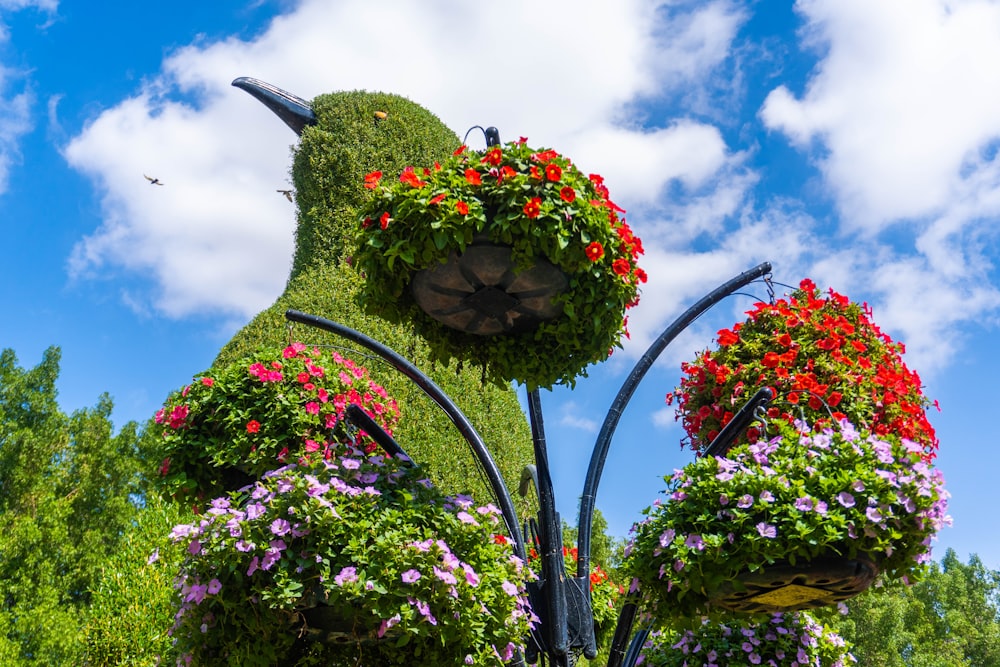 a sculpture of a bird made out of flowers