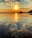 A serene sunset over a tranquil beach, symbolizing peace and reflection.