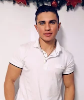 Smiling cleaning staff ready with supplies, showcasing the friendly team behind Reluciente.