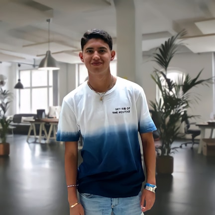 Moiz Ratlam warmly greeting clients in a modern office setting.