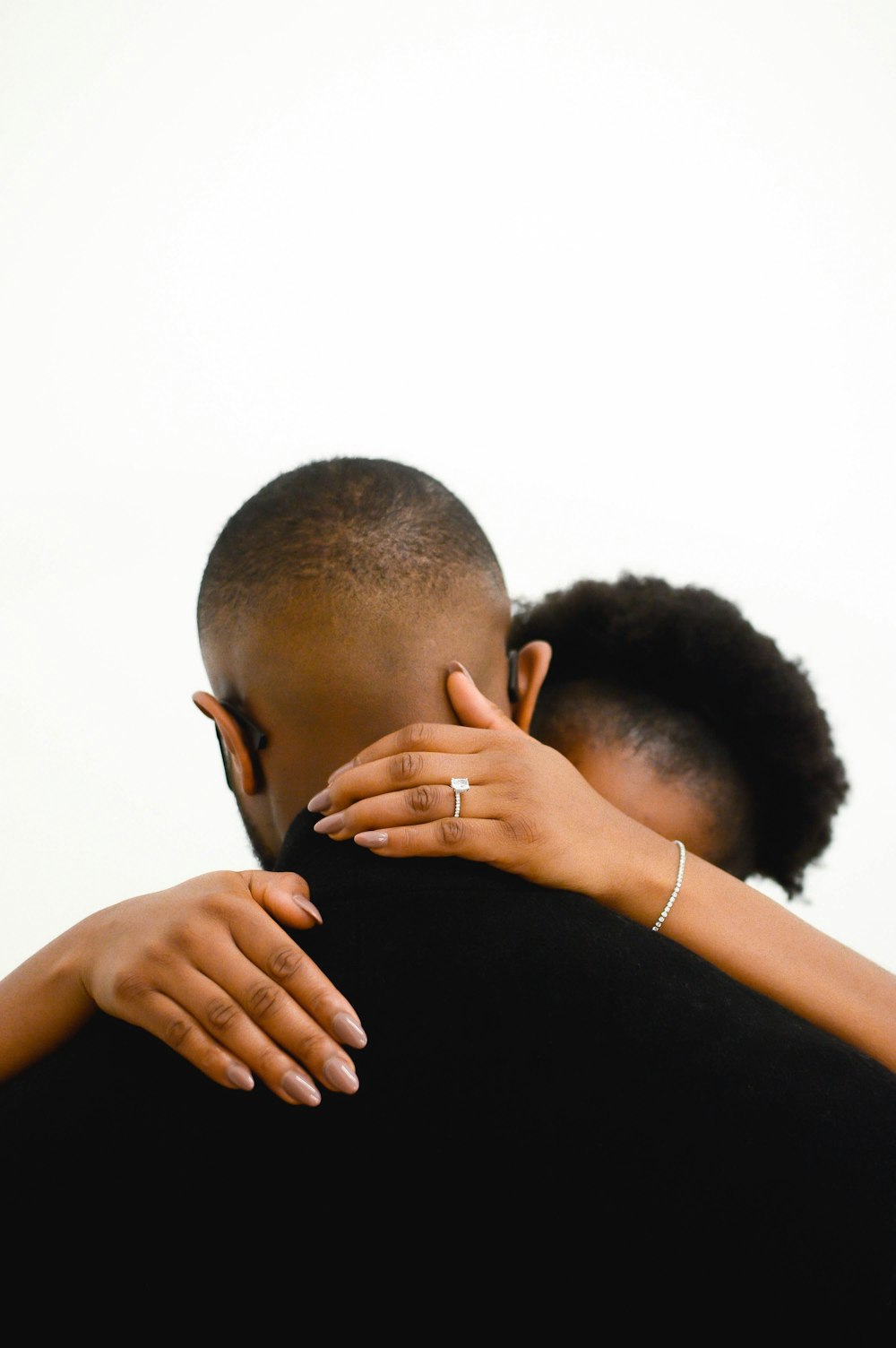 a man and a woman embracing each other