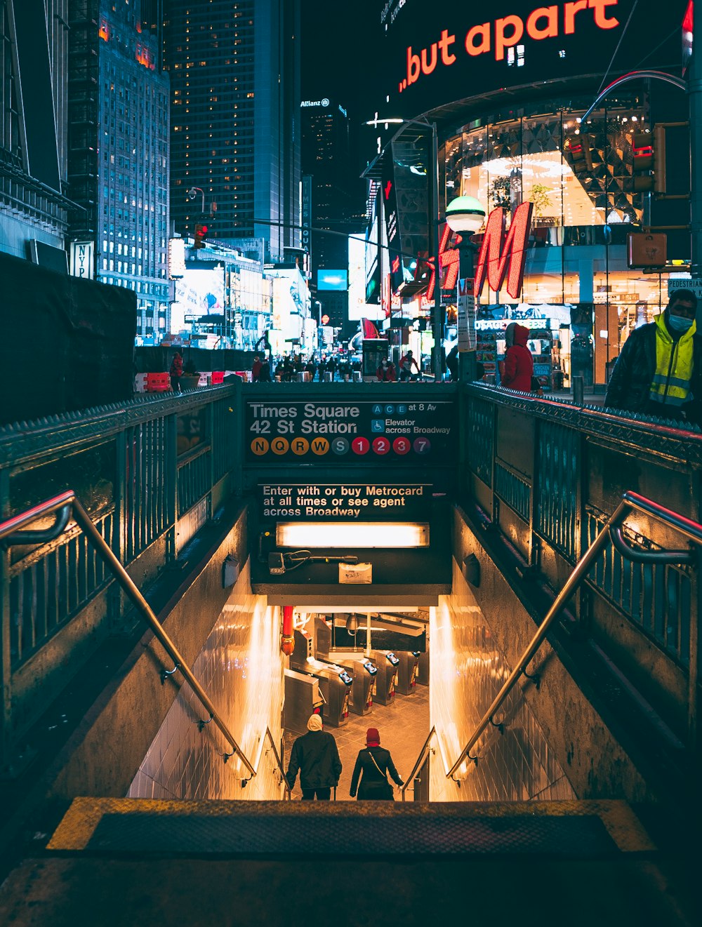 a couple of people that are walking down some stairs