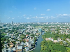 an aerial view of a river running through a city