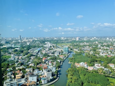 an aerial view of a river running through a city