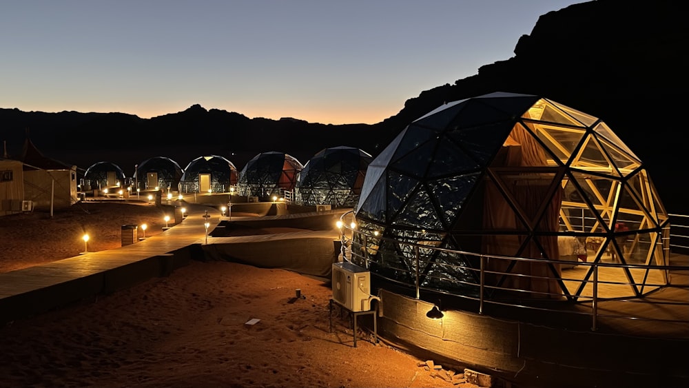 a group of domes lit up at night