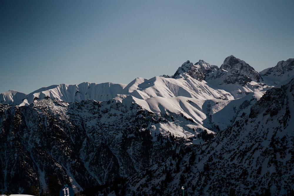 a view of a mountain range covered in snow