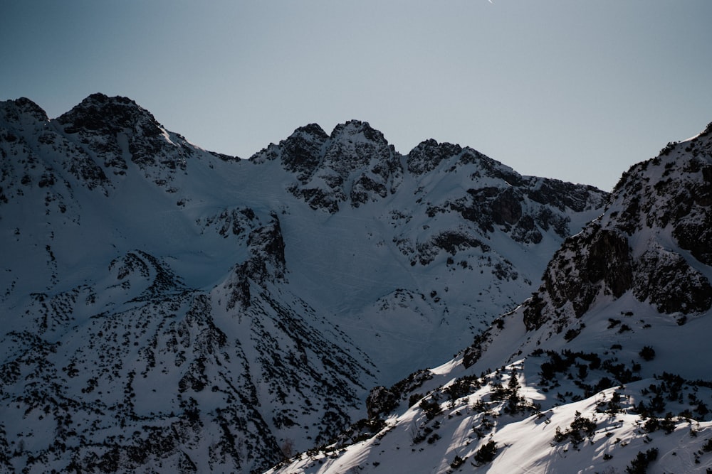 a view of a mountain range covered in snow