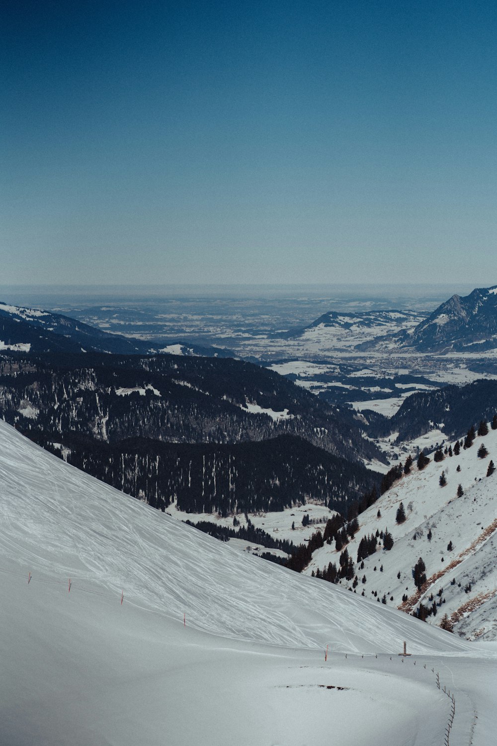 a person riding skis down a snow covered slope