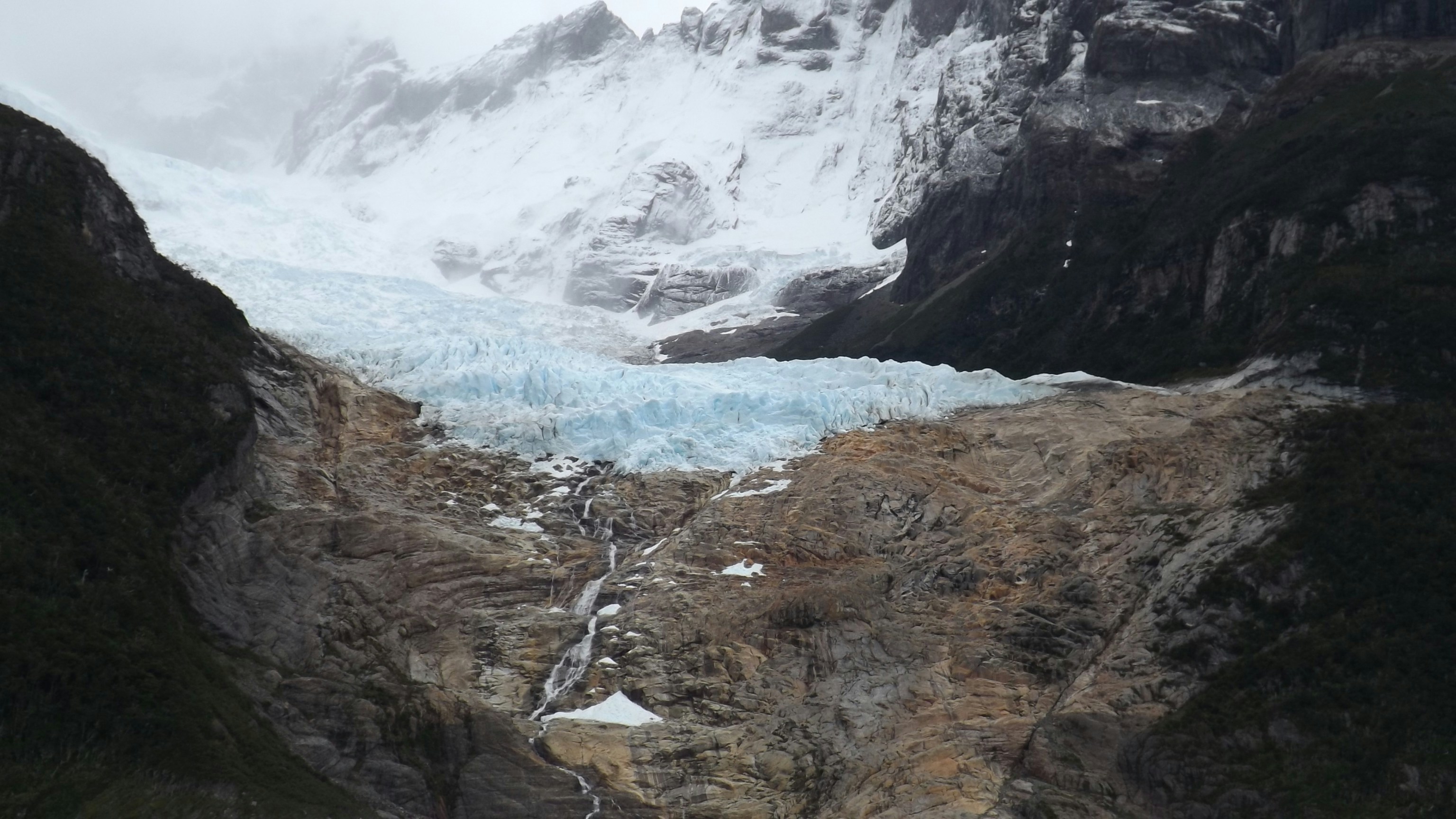 a glacier in the middle of a mountain range