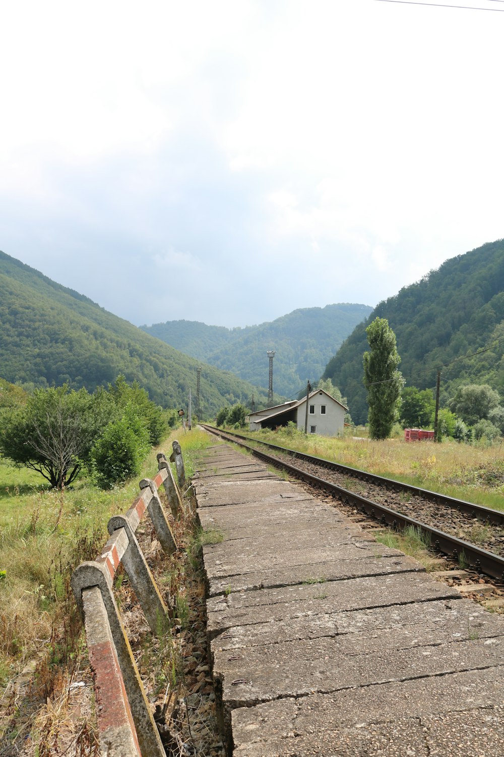 a train track running through a rural countryside