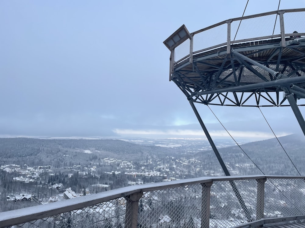 a view of a snowy landscape from a ski lift