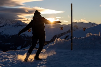 a man riding skis down a snow covered slope