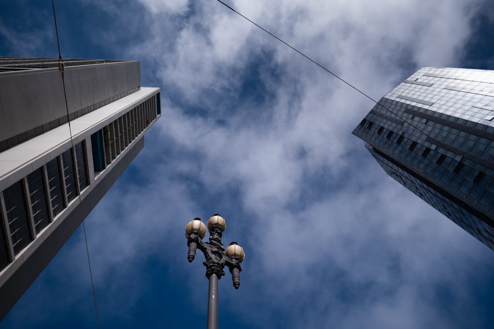 a couple of tall buildings sitting next to each other