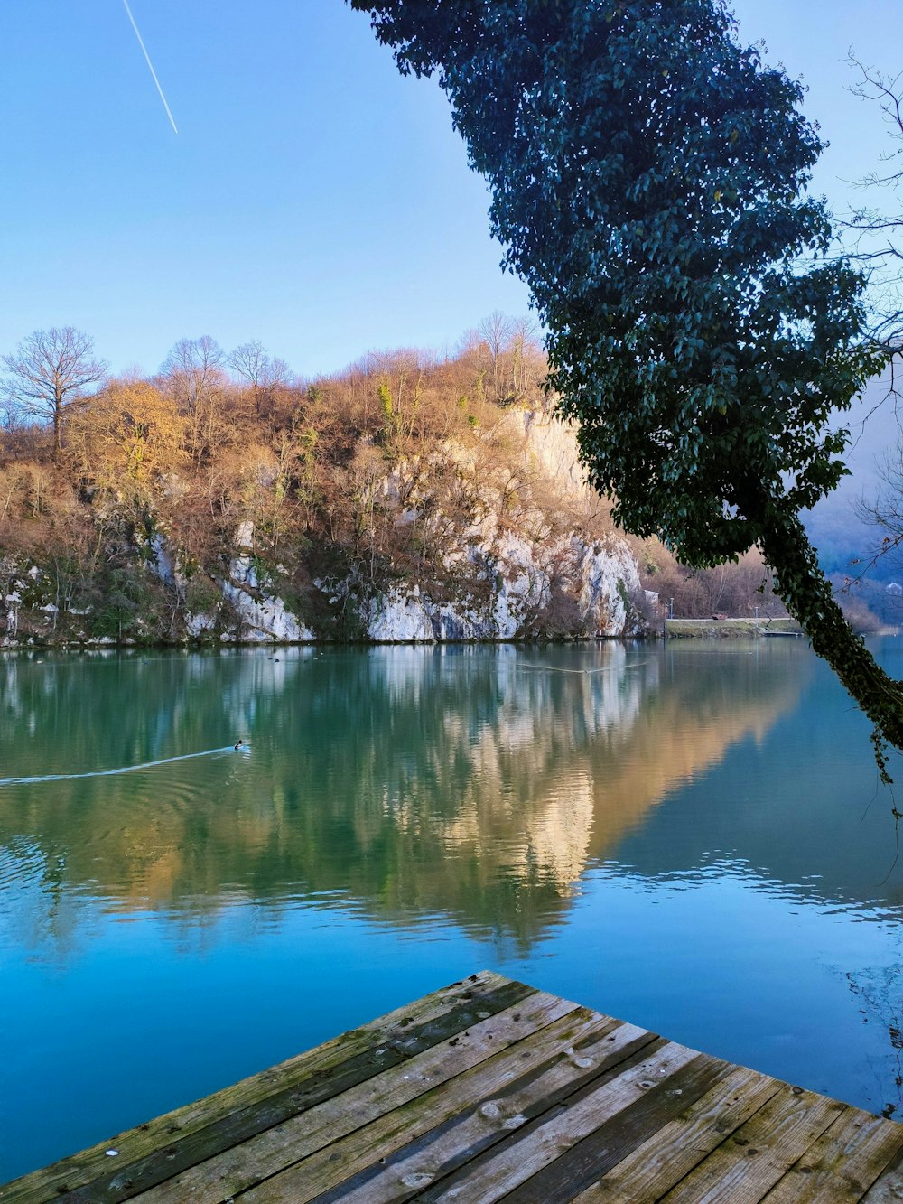 a wooden dock sitting next to a body of water