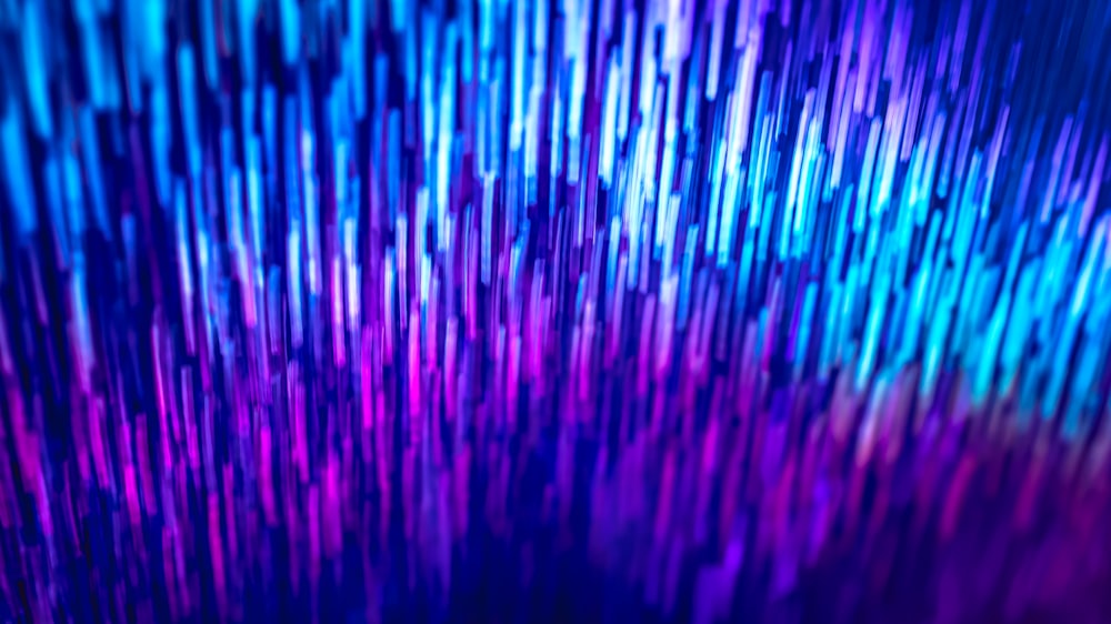 a blue and purple background with a lot of lines