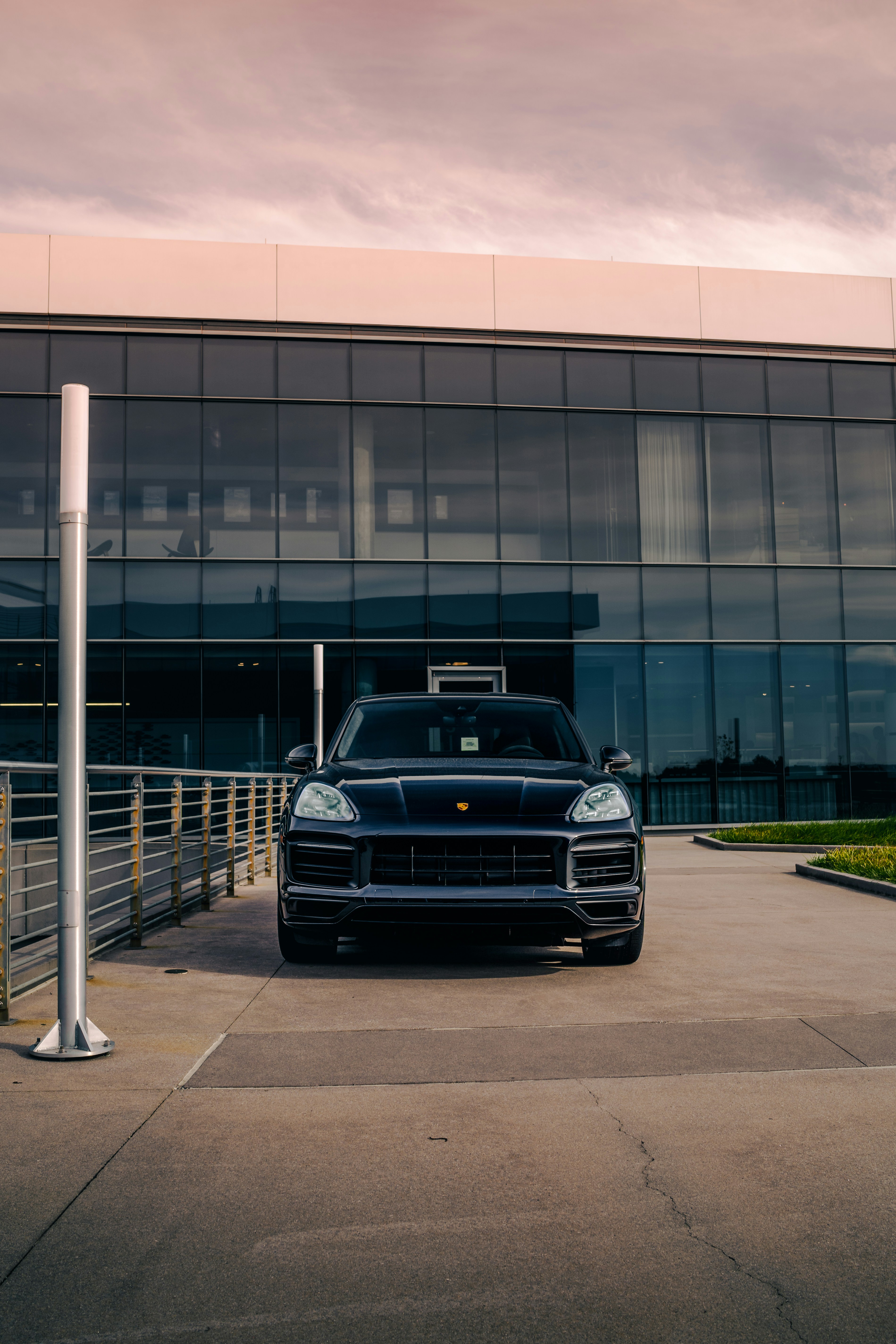 A black sports car parked in front of a building photo – Free Black ...