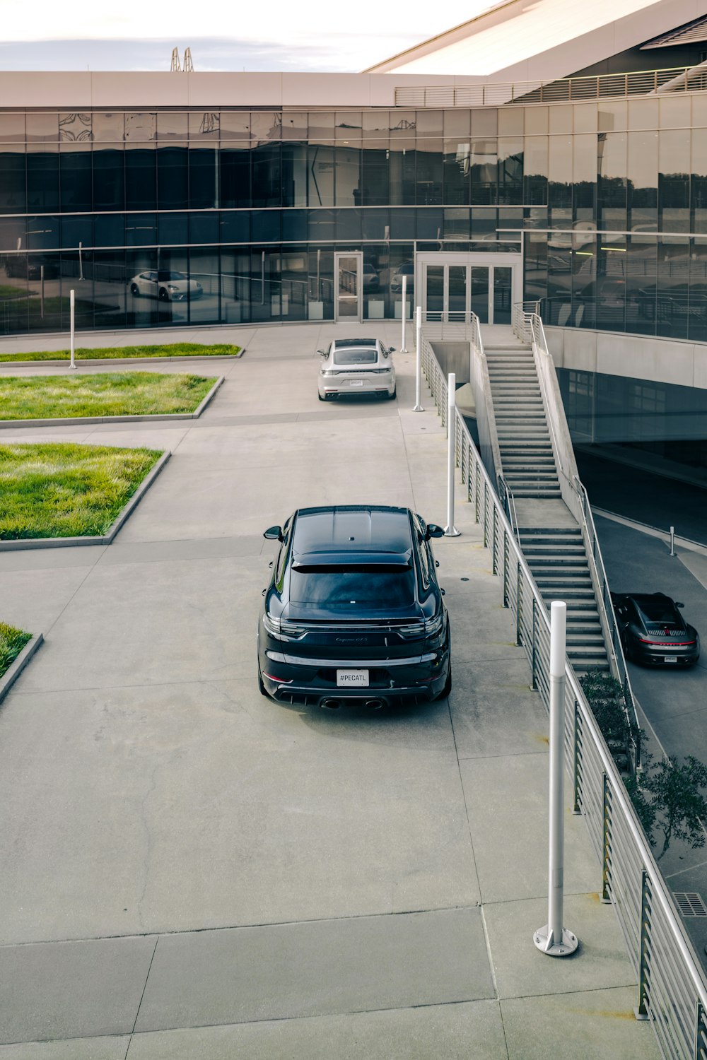 a car parked in a parking lot next to a building