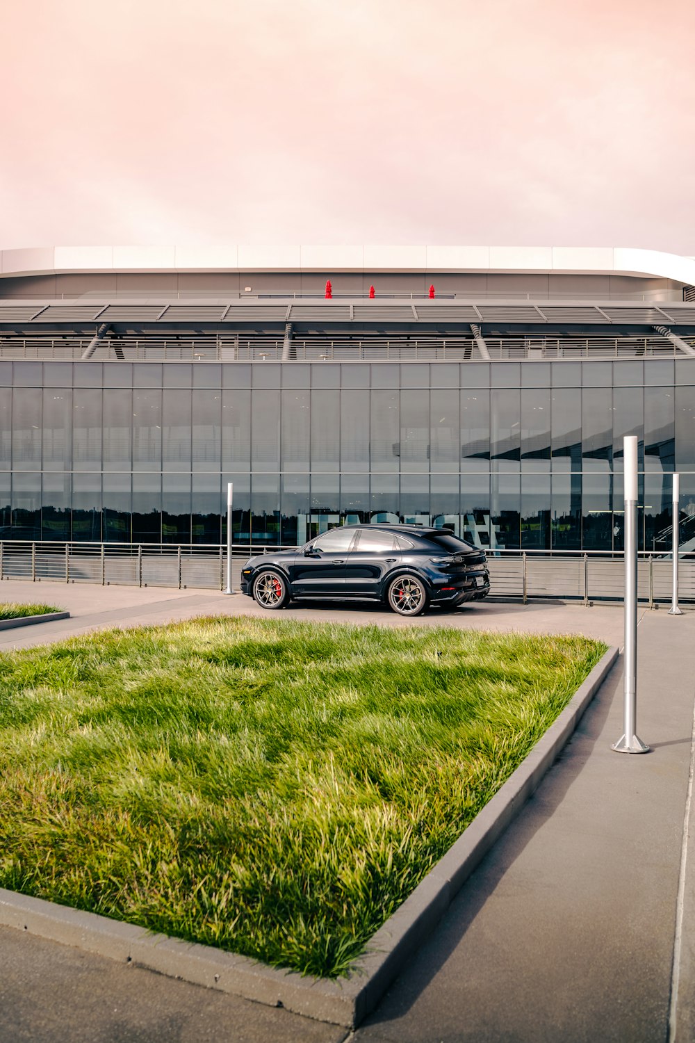 a black sports car parked in front of a building