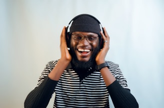 a man with a beard and glasses wearing headphones