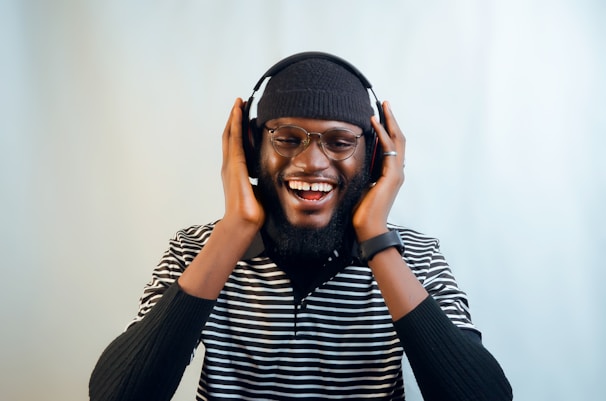 a man with a beard and glasses wearing headphones