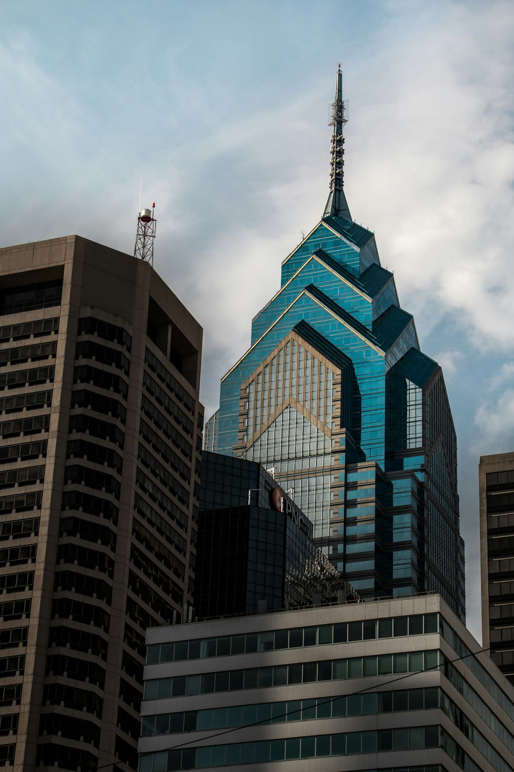 a very tall building with a blue roof