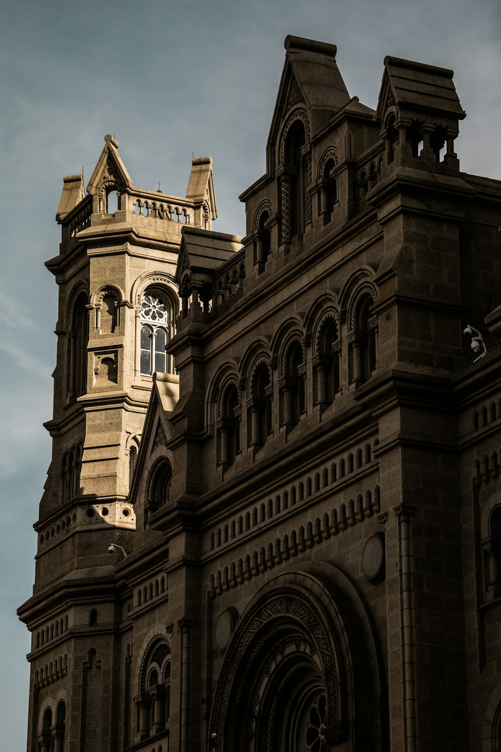 a very tall building with a clock on it's side