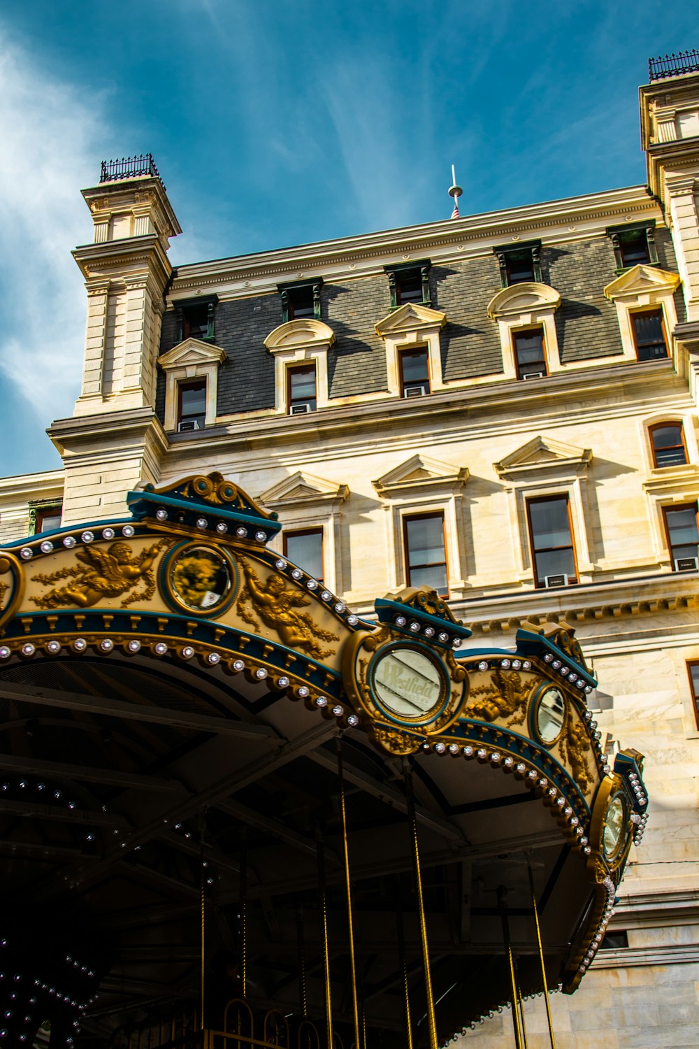 a carousel in front of a large building