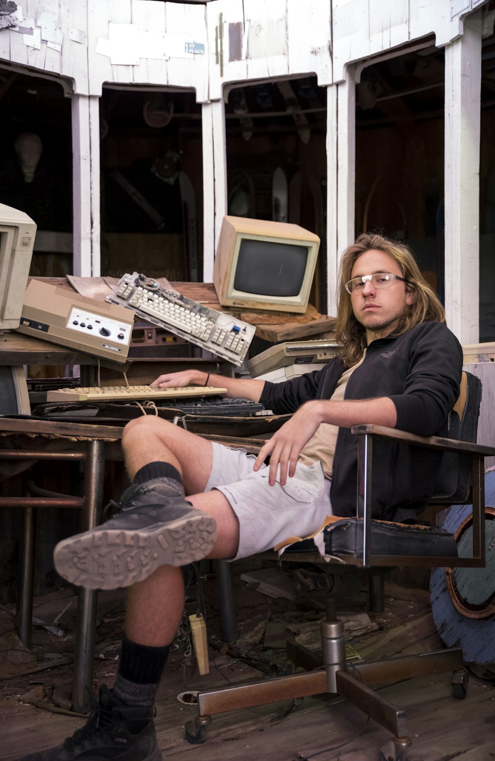 a man sitting in a chair in front of a computer