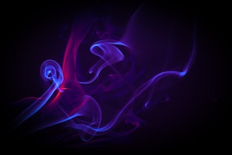 a purple and blue smoke swirl on a black background