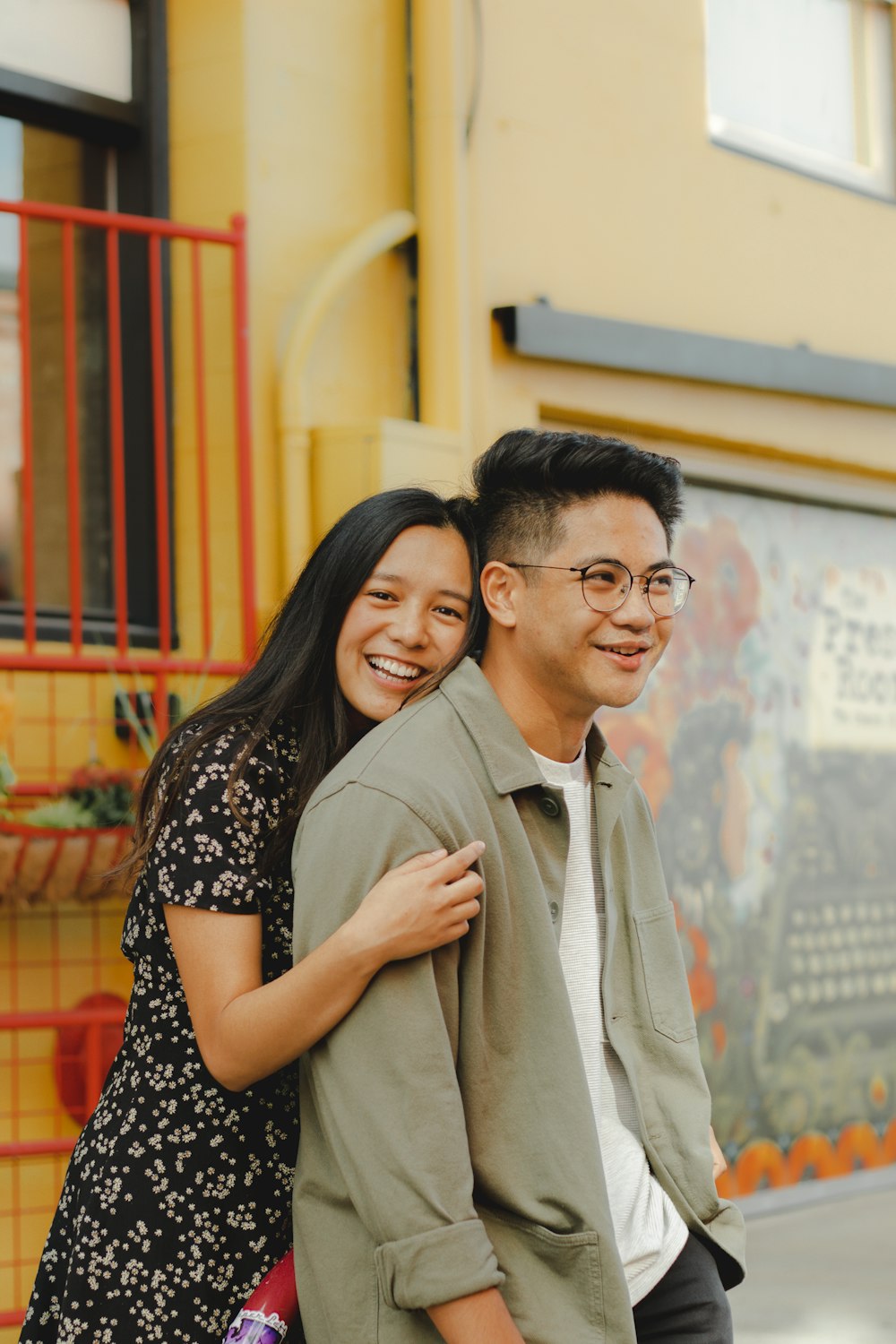 a man and a woman standing next to each other