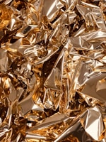 Close-up of a shiny gold foil roll used in printing.