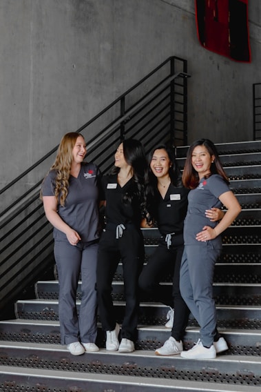 a group of women standing next to each other