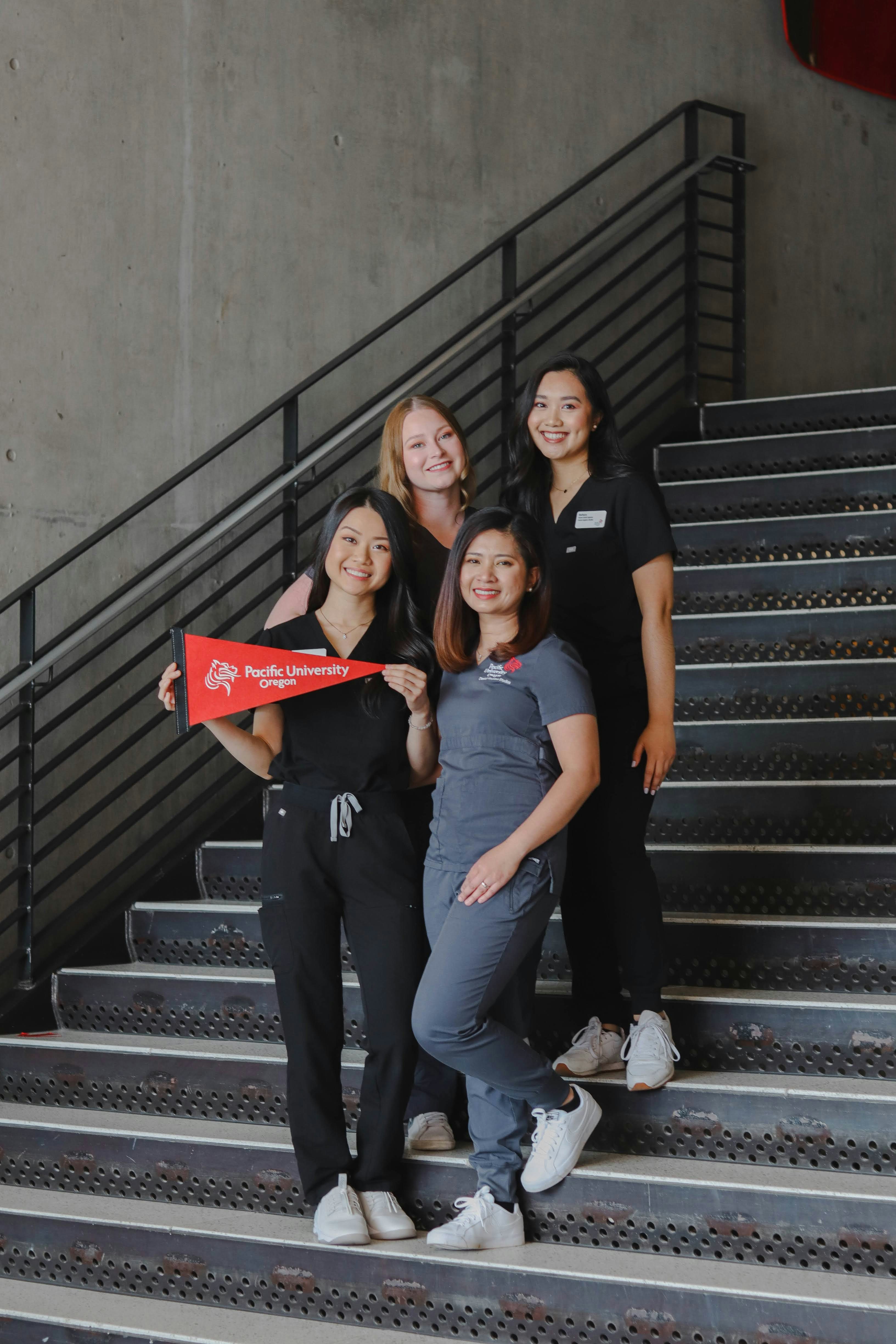 a group of women standing next to each other