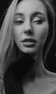 An artistic black-and-white portrait of Kayla Kua, capturing her contemplative side.