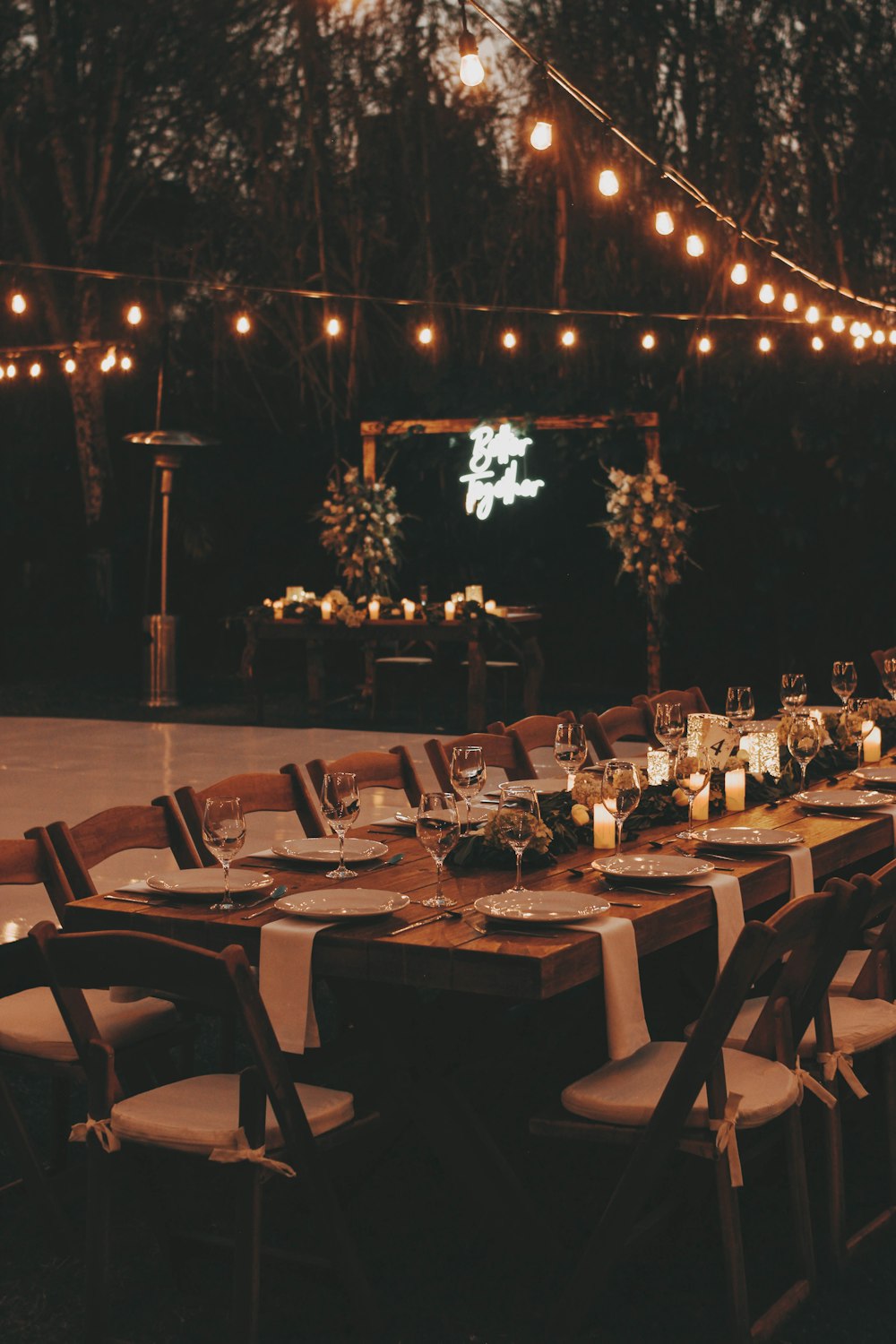 a long table is set up for a formal dinner