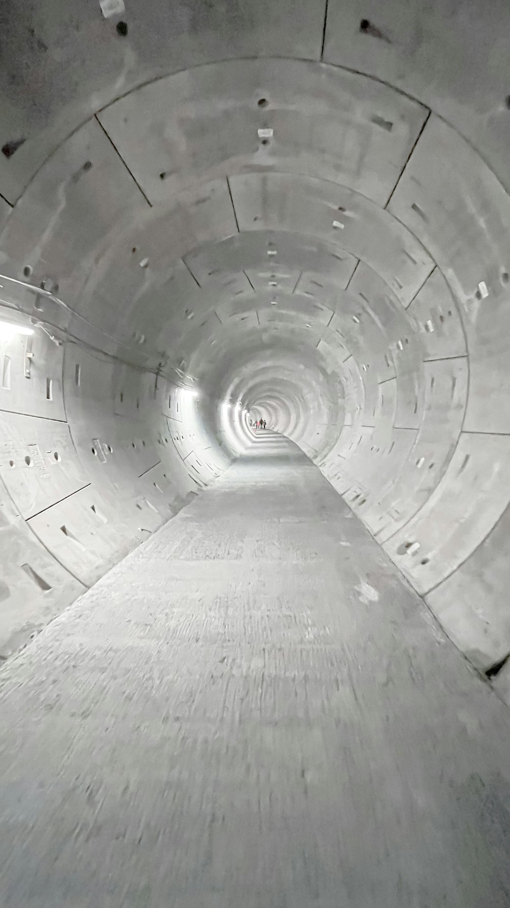 a very long tunnel with a light at the end