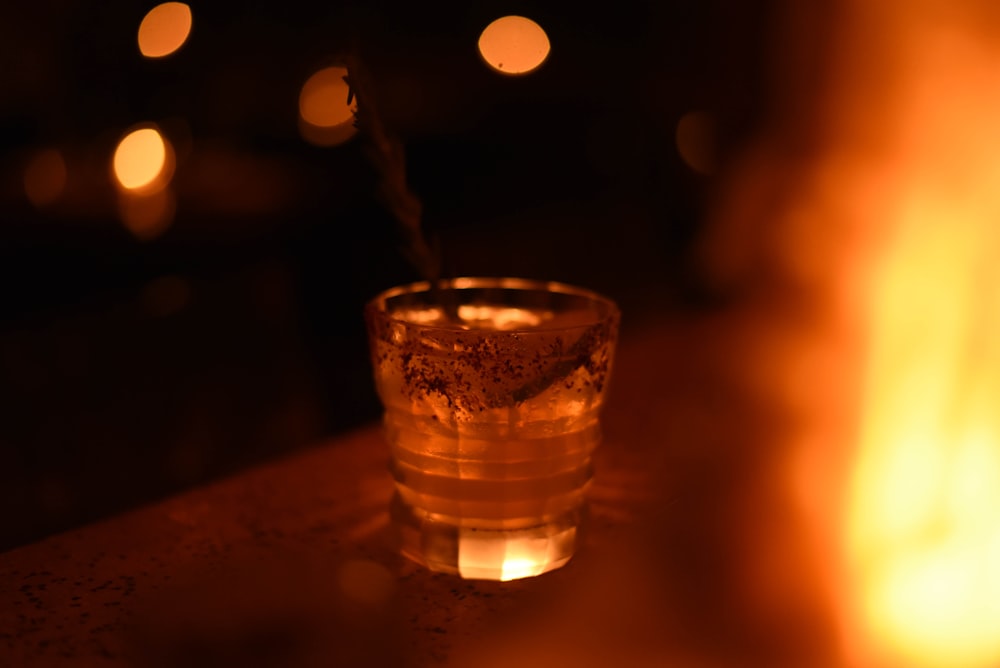 a glass of water sitting on top of a table