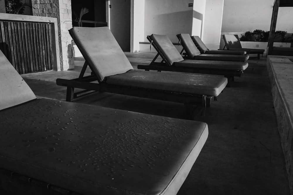 a row of lounge chairs sitting next to each other